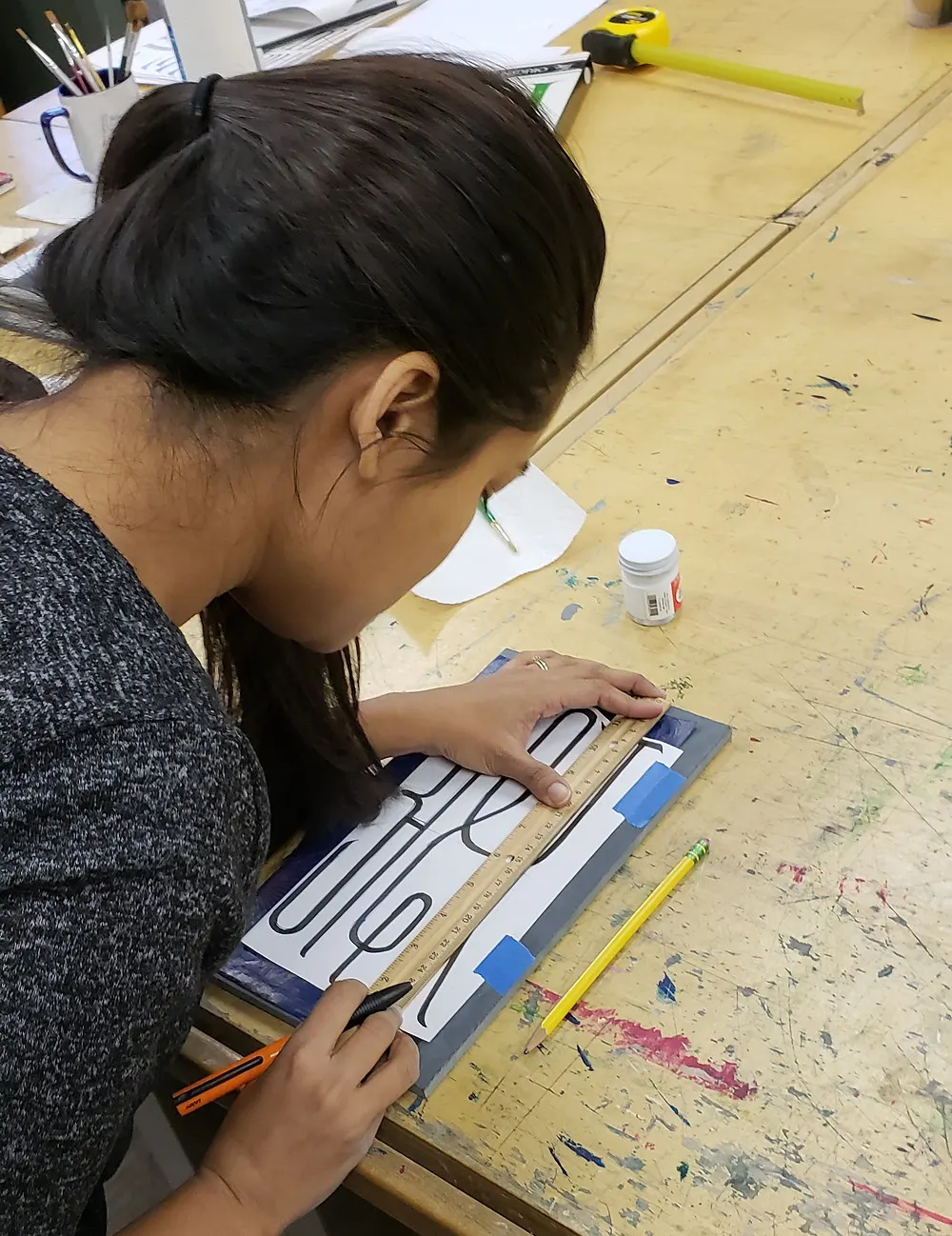 Measuring and placing the design on the stone.